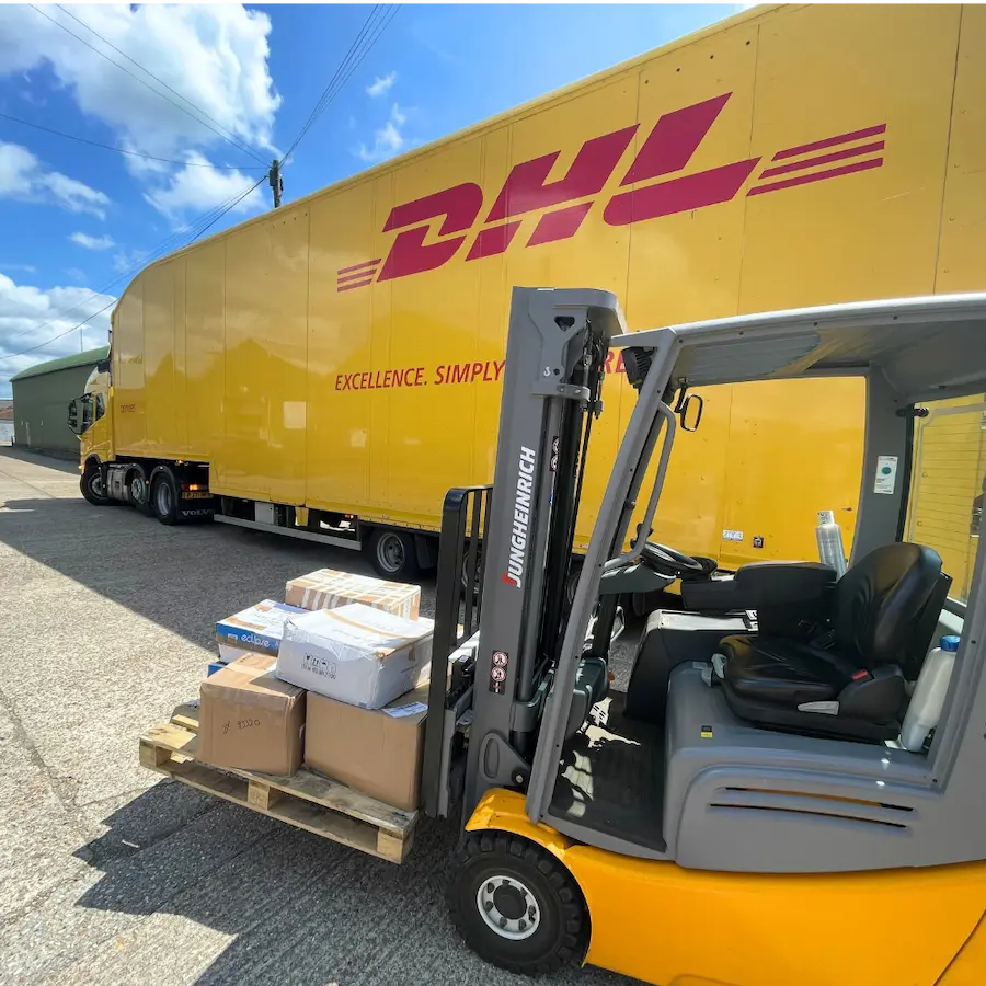 DHL lorry and forklift at the Books2Africa Processing Centre with deliveries of donated books