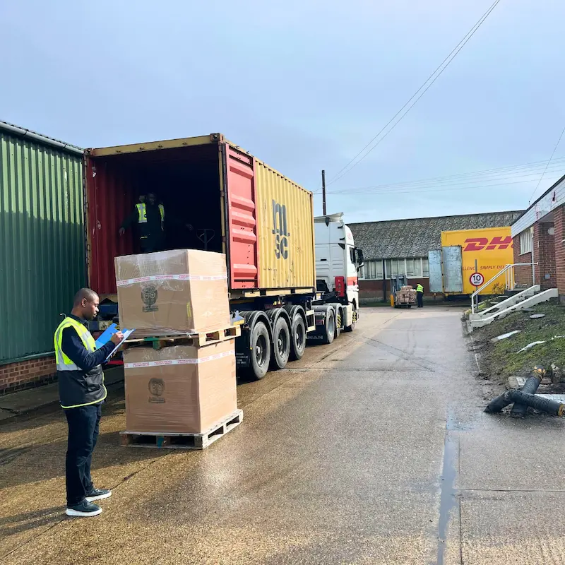 Books2Africa team loading a shipping container.